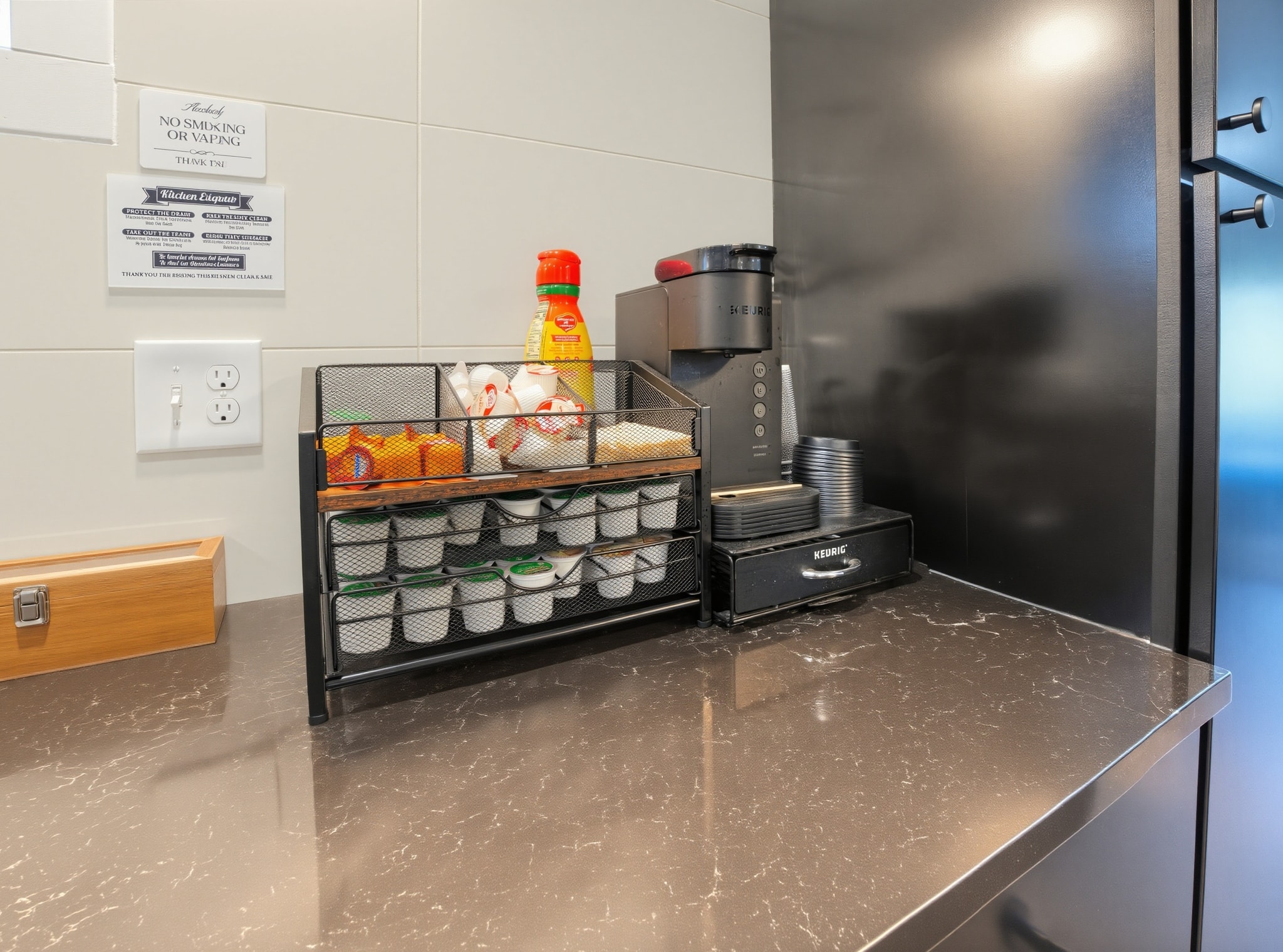 Keurig coffee station on black marble counter
