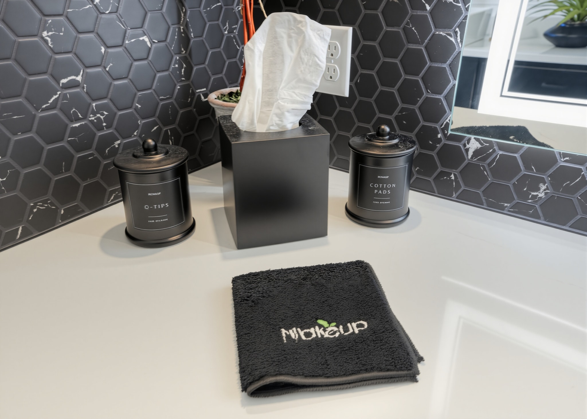 Bathroom vanity accessories with tissue box and makeup towel on hexagonal tile