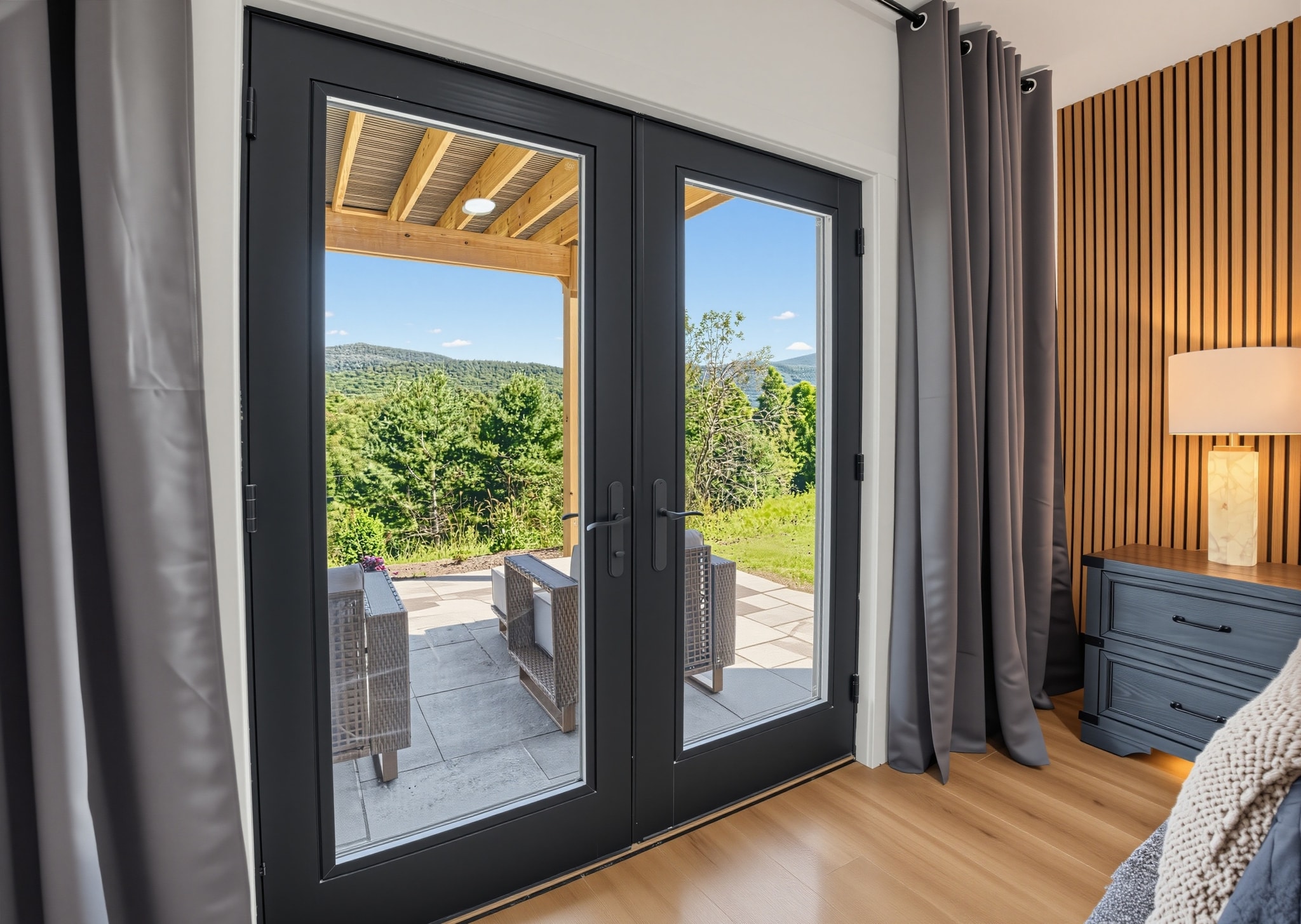Bedroom french doors opening to patio with mountain views