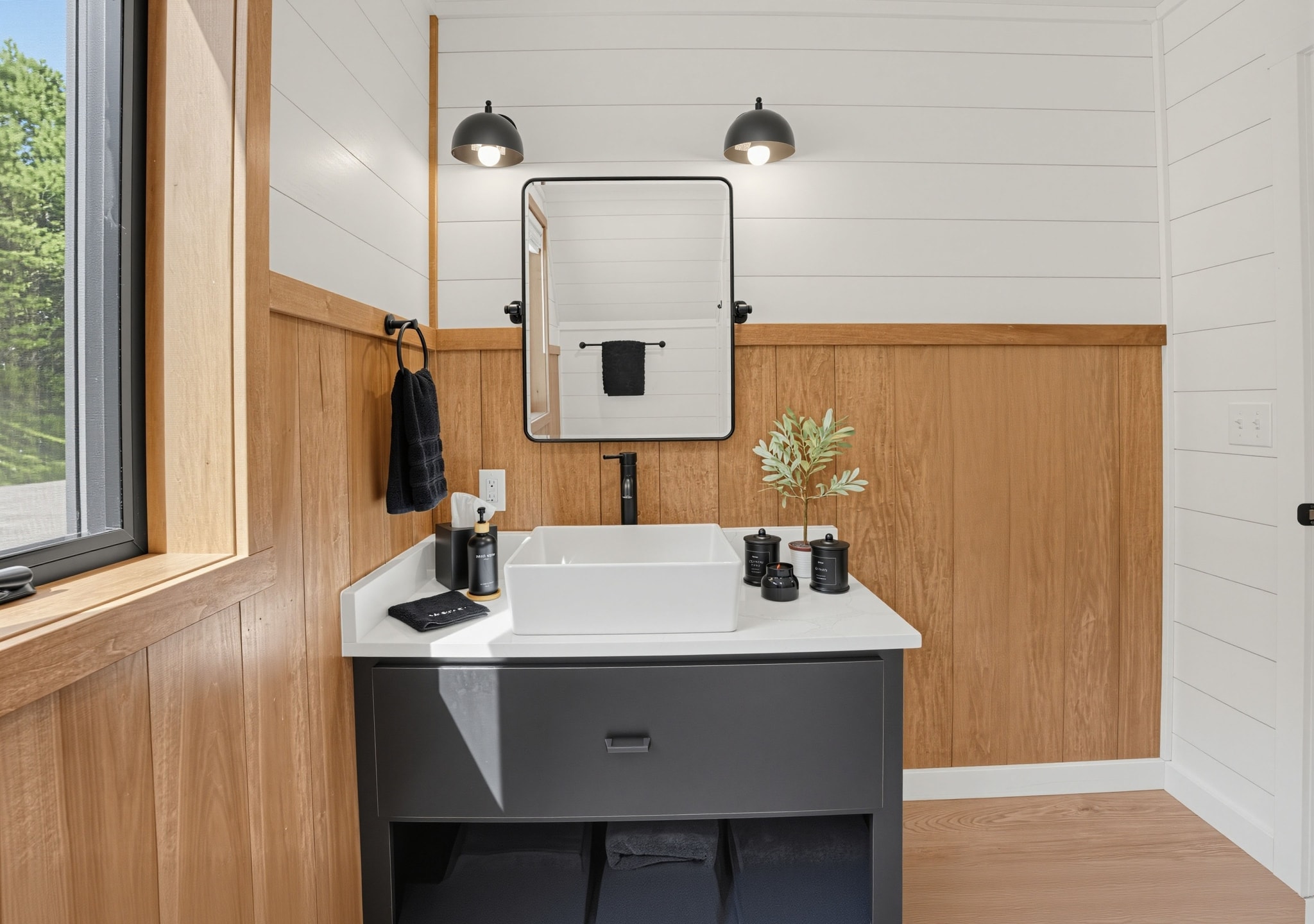 Guest bathroom vanity with vessel sink and black fixtures