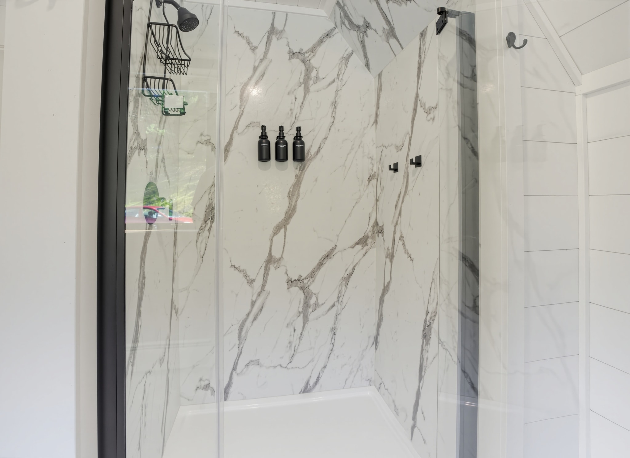 Guest bathroom marble shower enclosure