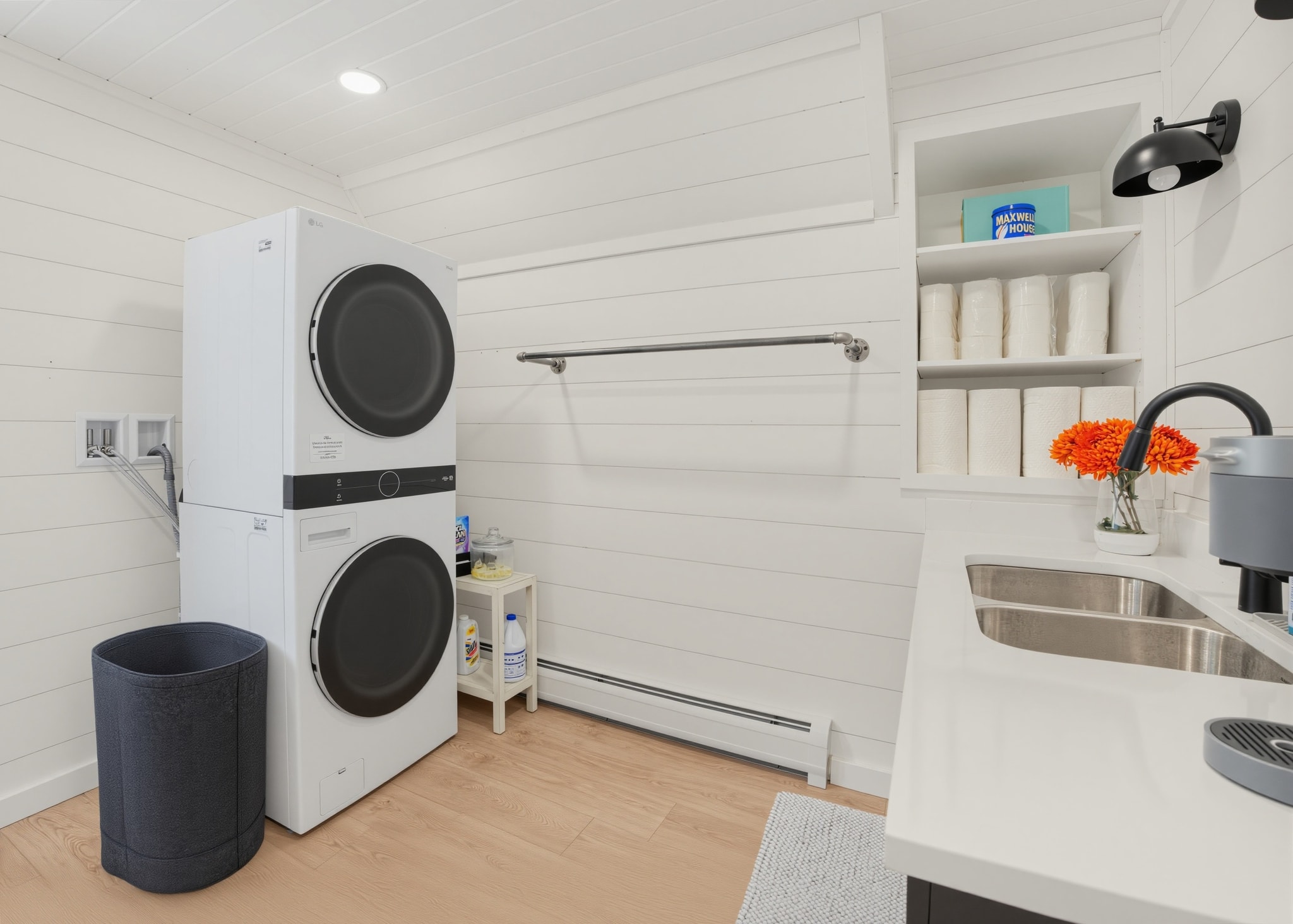 Laundry room with stacked washer and dryer