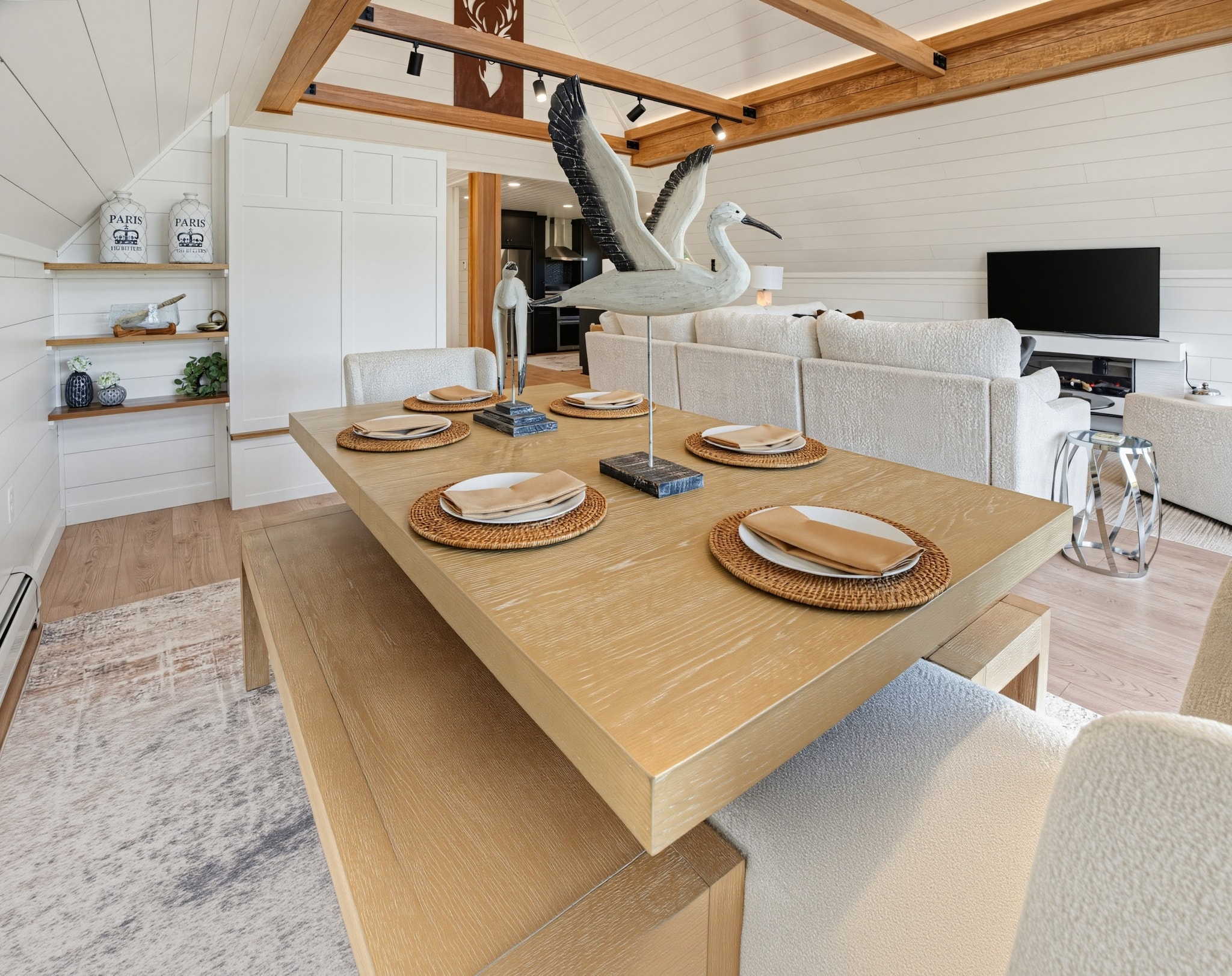 Living area with sliding glass doors to deck at dusk